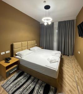 Postel nebo postele na pokoji v ubytování Hotel Milano