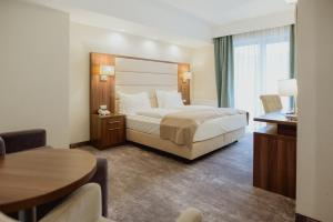 Postel nebo postele na pokoji v ubytování Radsor Hotel
