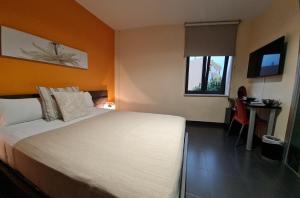 Łóżko lub łóżka w pokoju w obiekcie Hotel Los Nardos