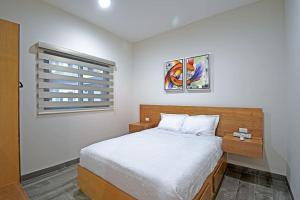 Postel nebo postele na pokoji v ubytování Encantador departamento en el corazón de La Paz + 14 fotografií