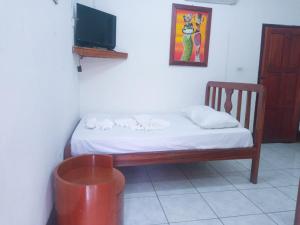 Postel nebo postele na pokoji v ubytování Hotel Ometepetl