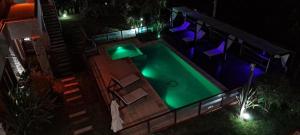 an overhead view of a swimming pool at night at Arena de Mar Depto E in Mar de las Pampas