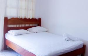 Postel nebo postele na pokoji v ubytování Hotel Ometepetl