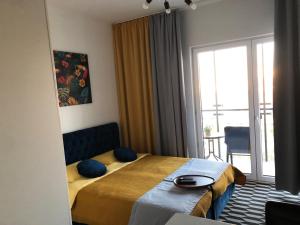 Posteľ alebo postele v izbe v ubytovaní Apartment