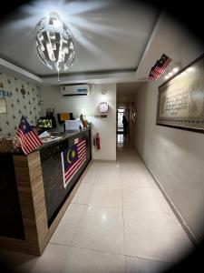 a restaurant with a counter with an american flag at FKI INTERNATIONAL HOTEL in Kuala Lumpur +16 photos