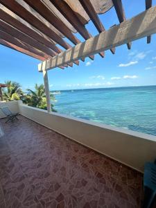 a view of the ocean from the balcony of a house at Loft Holp in Cancún