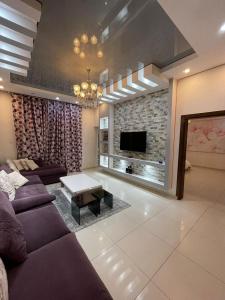 Гостиная зона в Deluxe Furnished Apartments