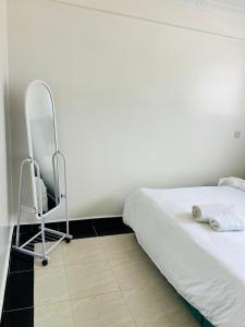 Ένα ή περισσότερα κρεβάτια σε δωμάτιο στο Rispers Homes Nanyuki +7 φωτογραφίες