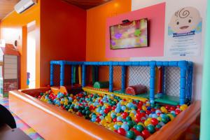 a large pile of balls in a play room at Hotel Experience João Fernandes in Búzios