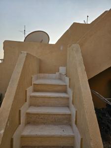 a set of stairs leading up to a building at Cozy and lovely studio in Cairo