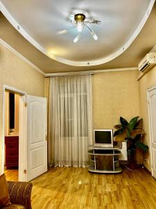 a living room with a laptop computer on a table at Apartment near train station and close to city center in Kyiv