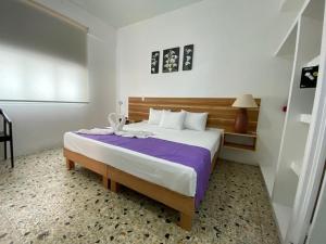 Postel nebo postele na pokoji v ubytování Casa Gubidxa