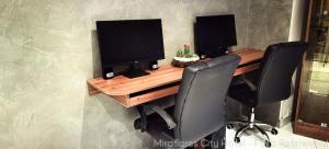 a desk with two monitors and two chairs at MIRAFLORES CITY HOTEL in Lima