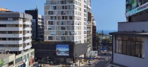 an aerial view of a city with tall buildings at MIRAFLORES CITY HOTEL in Lima