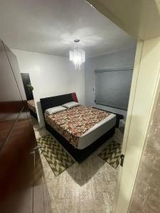 a small bedroom with a bed in a room at Chácara Boa Vista Santa Isabel SP in Santa Isabel