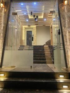 a view of a glass window of a building with stairs at شقة فندقية على البحر 3 in Hurghada