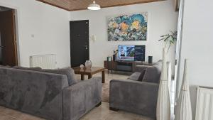 Μια τηλεόραση ή/και κέντρο ψυχαγωγίας στο STAY Uptown Apartment