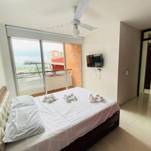 Giường trong phòng chung tại Sensacional Apartamento Reserva Peñon Girardot