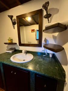 a bathroom with a sink and a mirror at Locanda delle sorelle in Campagnano di Roma +40 photos