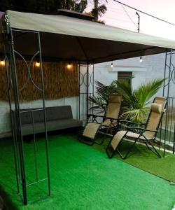 Patio nebo venkovní prostory v ubytování CycIoneda House