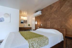 Postel nebo postele na pokoji v ubytování Hotel Aqua Rio