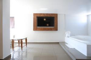 Postel nebo postele na pokoji v ubytování Hotel Aqua Rio