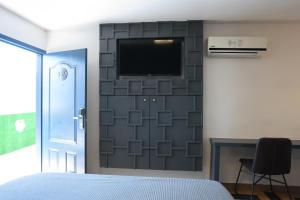 TV a/nebo společenská místnost v ubytování Hotel Aqua Rio