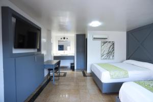 Postel nebo postele na pokoji v ubytování Hotel Aqua Rio