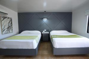 Postel nebo postele na pokoji v ubytování Hotel Aqua Rio