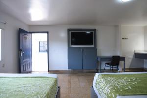 Postel nebo postele na pokoji v ubytování Hotel Aqua Rio