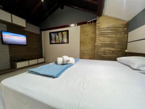 Espaço Verano - Suítes客房内的一张或多张床位