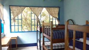 Voodi või voodid majutusasutuse Hostal Juan Lindo toas
