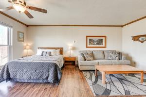 a bedroom with a bed and a couch at Ski-In/Ski-Out Brian Head Studio in Brian Head +26 photos
