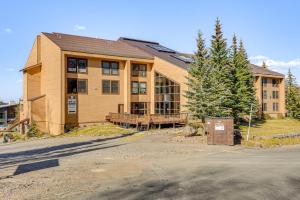 a large wooden building with a table in front of it at Ski-In/Ski-Out Brian Head Studio in Brian Head