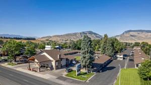 an aerial view of a small town with mountains at Best Western Sunset Inn in Cody