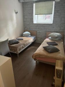 Postel nebo postele na pokoji v ubytování Süda Hostel