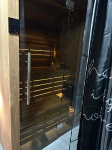 a glass door of a elevator in a building at Plivska vila 1 in Jajce +20 photos