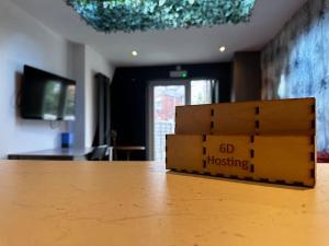a stack of boxes sitting on top of a table at Central City Living - Stylish & Spacious 5 Bedrooms in Parkside