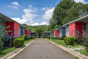 a road leading to a row of houses at Oceantide Playa Hermosa in Playa Hermosa