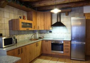 Kuchyň nebo kuchyňský kout v ubytování Apartamentos Fogaron
