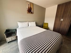 Postel nebo postele na pokoji v ubytování Royal Rest Imbabura