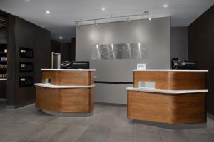a salon with two wooden counters in a room at Courtyard by Marriott Philadelphia Bensalem in Bensalem +27 photos