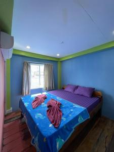 Postel nebo postele na pokoji v ubytování Villa Koh Rong