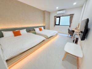 Postel nebo postele na pokoji v ubytování 東港民宿 - 如你所院 Tourist Vacation B&B
