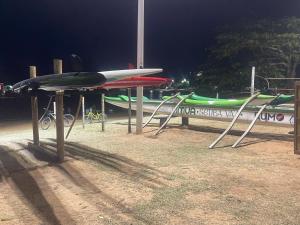 a group of surfboards on display on a table at Pousada Recanto dos Colibris in Guarapari