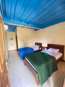 Postel nebo postele na pokoji v ubytování Pieter homestay + 4 fotografie