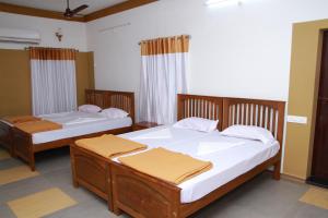 Ένα ή περισσότερα κρεβάτια σε δωμάτιο στο Pearl Beach Bungalow