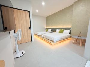 Postel nebo postele na pokoji v ubytování 東港民宿 - 如你所院 Tourist Vacation B&B