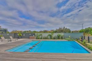 a swimming pool on the roof of a house at The Millennial Cosy stay in Durban