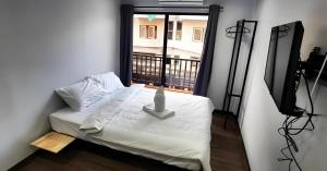 GO INN Chiang Mai University - CMU客房内的一张或多张床位
